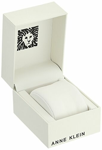 Open Anne Klein watch box with lion logo.