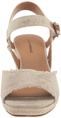 Front view of a beige espadrille wedge sandal with ankle strap.