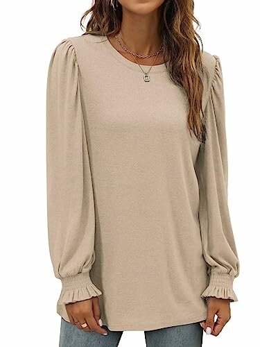 Woman wearing a beige puff sleeve blouse