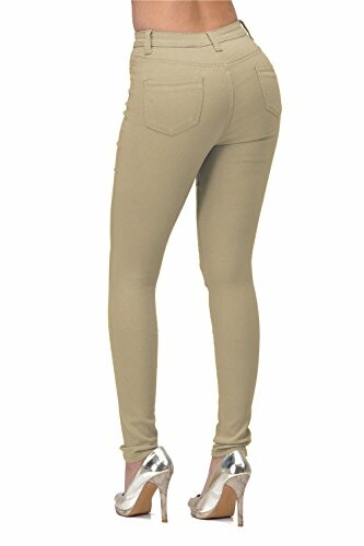 Back view of beige skinny jeans with silver high heels.