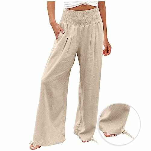 Woman wearing beige wide-leg pants with a smocked waist.