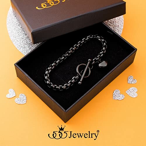 Black bracelet in a jewelry gift box with heart decorations