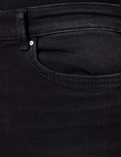 Close-up of black denim jeans pocket