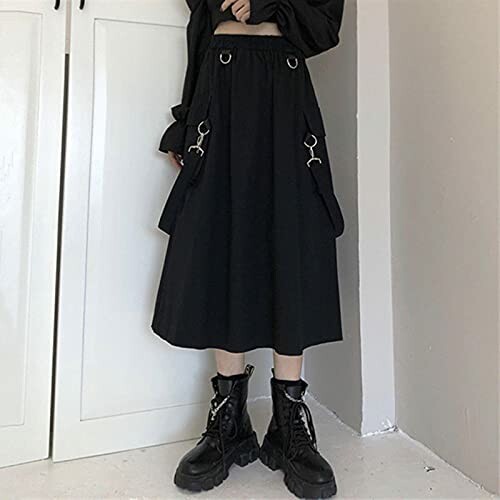 Person wearing a black gothic skirt with boots.