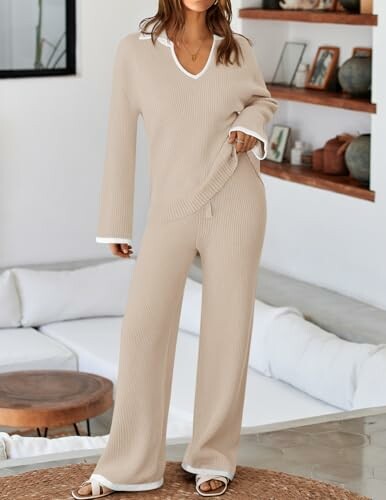 Woman wearing a beige lounge set in a modern living room.