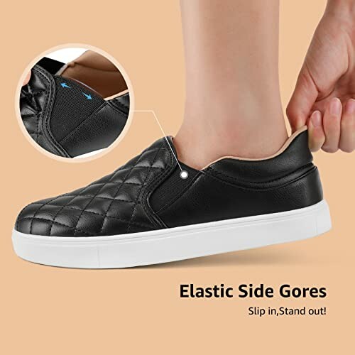 Black quilted slip-on sneakers with elastic side gores.