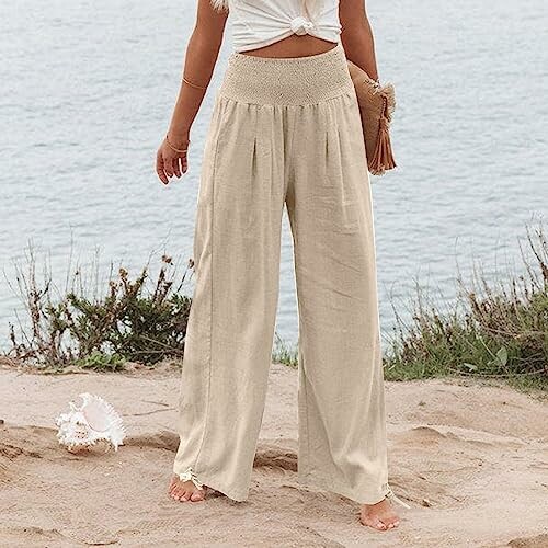 Woman in beige pants by the beach