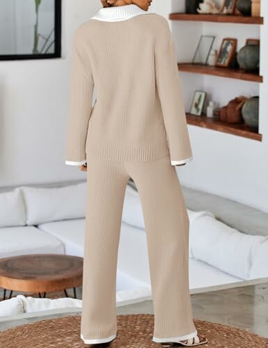 Woman wearing beige loungewear set in a modern living room