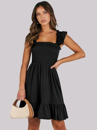 Woman in a black dress holding a handbag