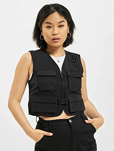 Woman wearing a black utility vest with pockets