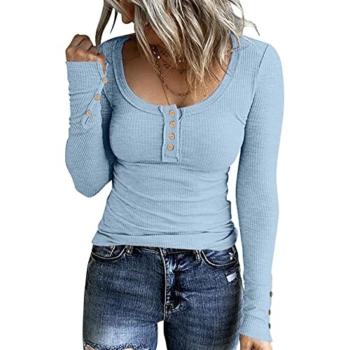 Woman in blue long sleeve top with button details